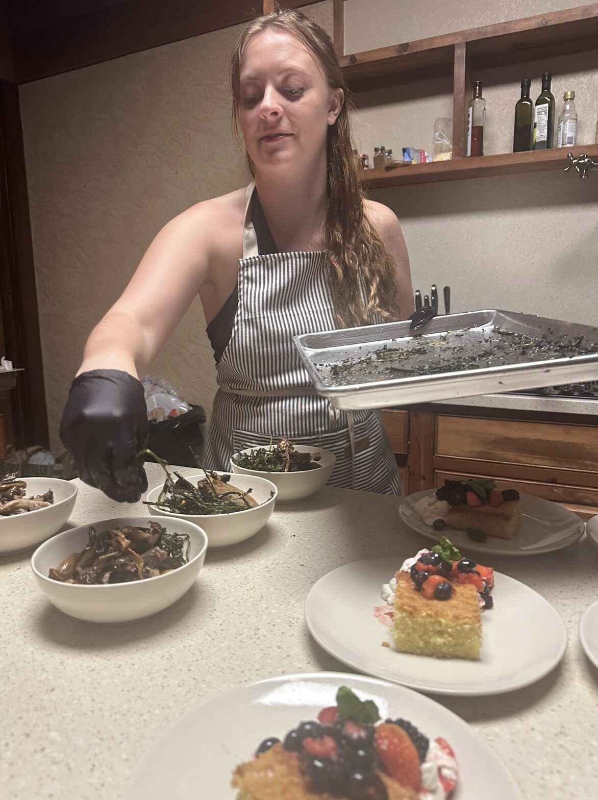 Anna plating in kitchen, action shot
